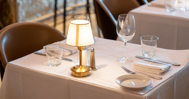 Interior, dining area with table set for guests