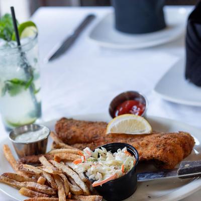 Fried haddock, fries, and coleslaw.