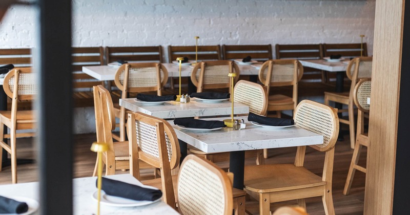 Tables for two people, ready for guests