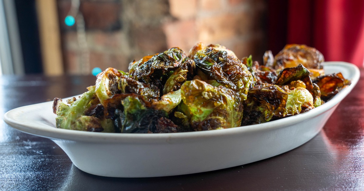 Rroasted Brussels sprouts served in a oval dish