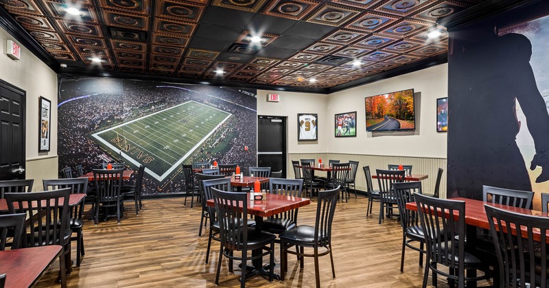 Picture of football stadium on wall in dining area