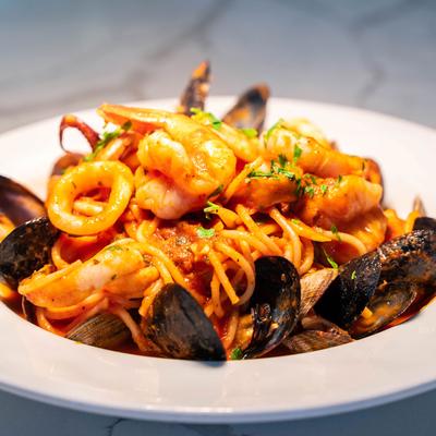 Spaghetti with mussels, clams, and calamari, in tomato sauce