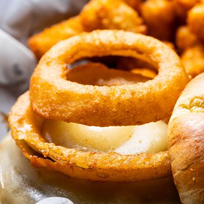Whiskey Pepper Cheeseburger, topped with an onion ring.