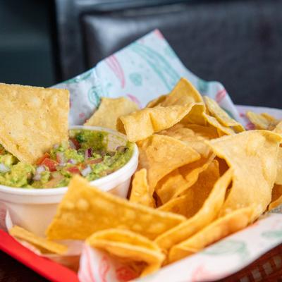Guacamole served with tortilla chips.