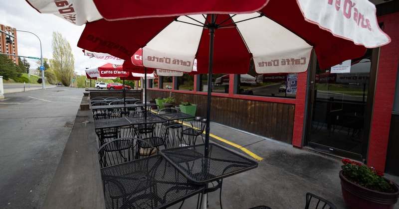 Outside seating area with red and white sun umbrellas