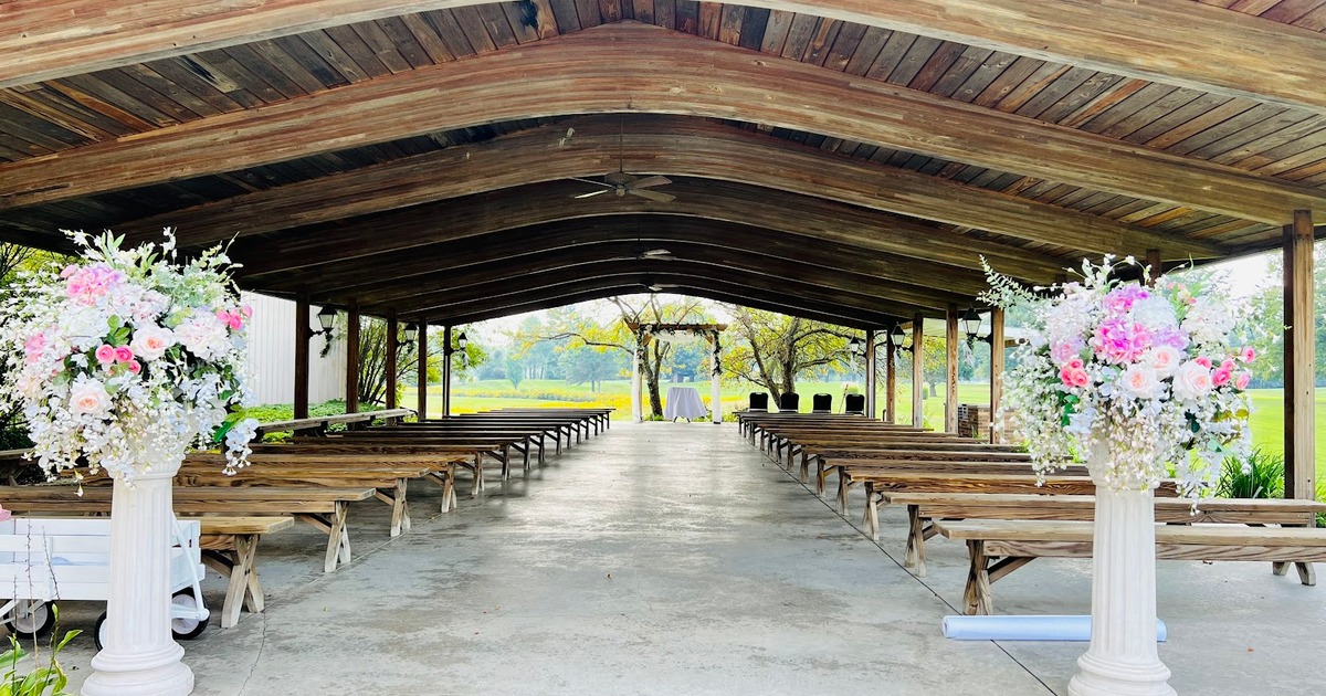 An outdoor pavilion with bench seating