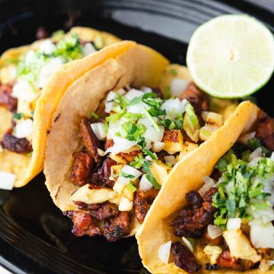 Served tacos al pastor.