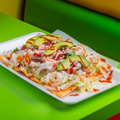 Wheat based snack topped with various ingredients.