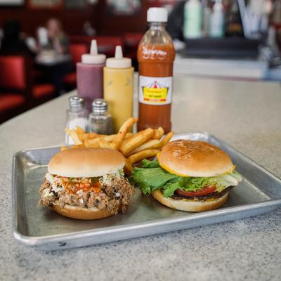 Pulled pork sandwich, cheeseburger, and fries.