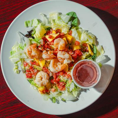 Mango Shrimp Salad served with dressing on the side.