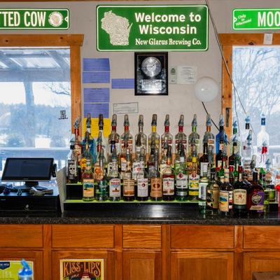 Stacked bottles behind the bar.