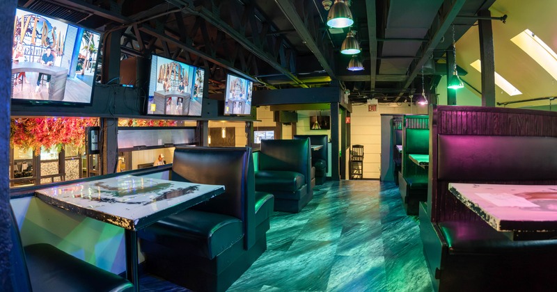 Interior, dining area, seating booths with wooden top tables, tile flooring