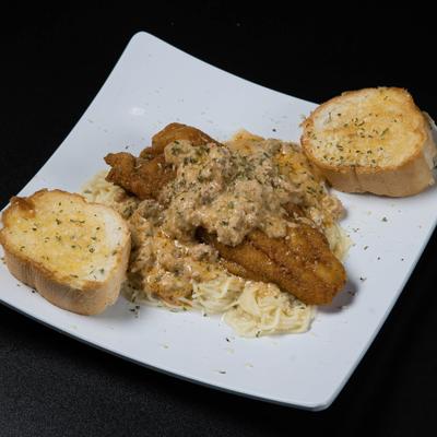 Cajun fish pasta with garlic bread.