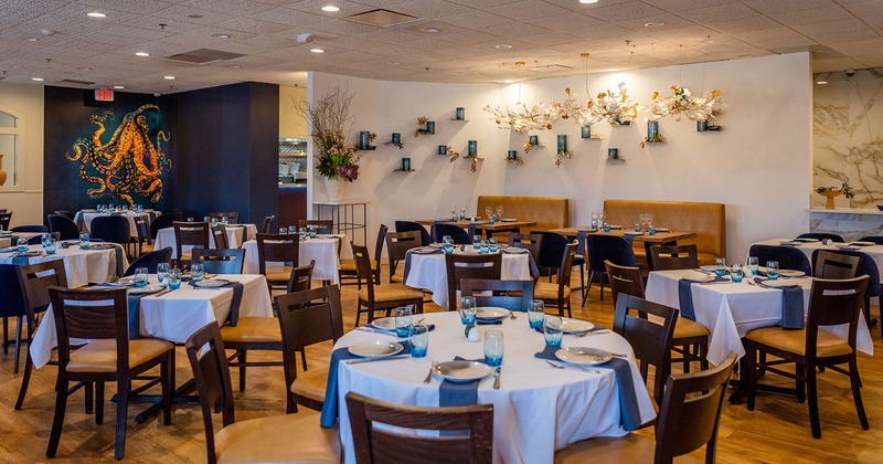 Interior, dining area, tables with tableware ready for guests