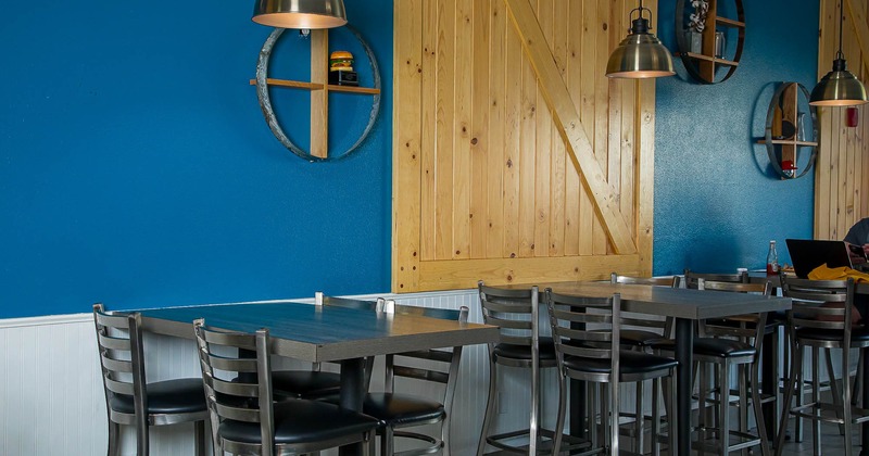 Interior, tables and chairs in seating area