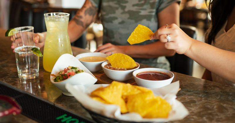 Snacks, red dip and cocktails