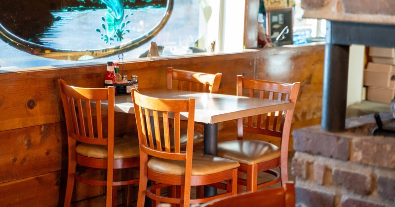 Wooden dining table for four guests