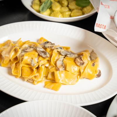 Pappardelle pasta, with mushrooms and truffle cream.