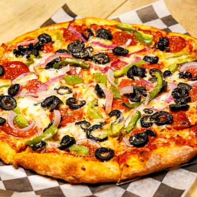 Brooklyn Supreme Pizza featuring pepperoni, black olives, onions, and bell peppers.