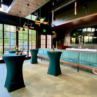 Cocktail tables in a room with banquette sofas.