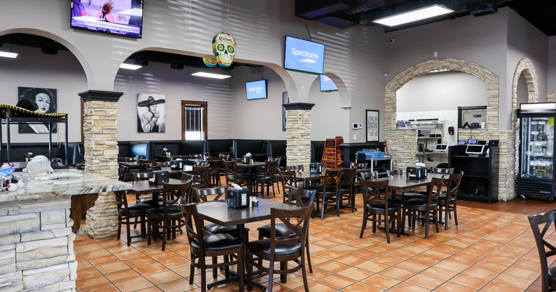 Interior, tables and chairs in dining area
