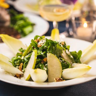 Endive salad, with arugula, pears, raising, walnuts, gorgonzola and honey dressing
