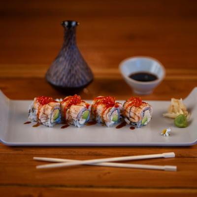 Angel Roll with spicy crab meat, avocado, seared salmon, roe, and eel sauce.