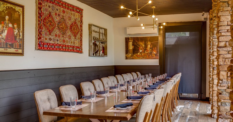 Interior, fully set table with pictures  on the wall