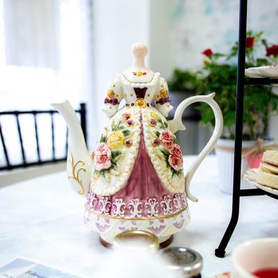 An intricate porcelain tea pot.