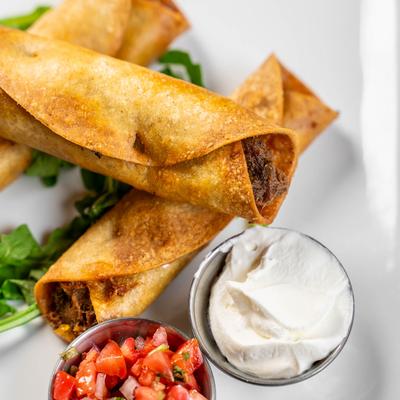 The Three Taquitos with sour cream and fresh salsa.