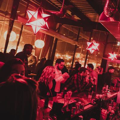 Guests enjoying drinks, bar area