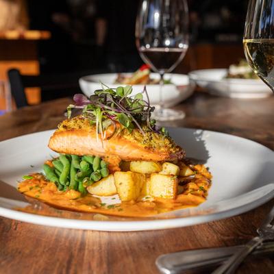 Sicilian steelhead, green beans and poached potatoes, served with white wine.