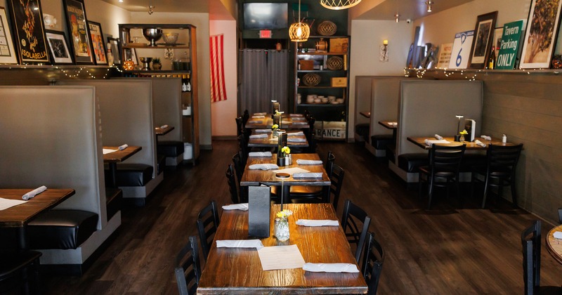 Modern and cozy interior dining area with set tables ready for guests