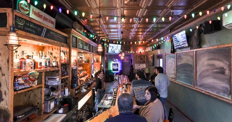 People having drinks at a busy bar