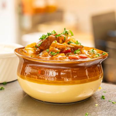 Beef stew with vegetables served in a ceramic bowl.