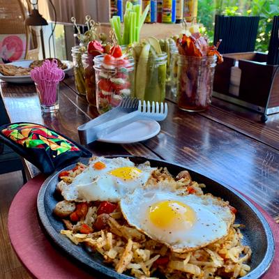 Skillet breakfast topped with two sunny eggs.