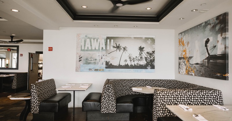 Restaurant interior with patterned booths and artwork