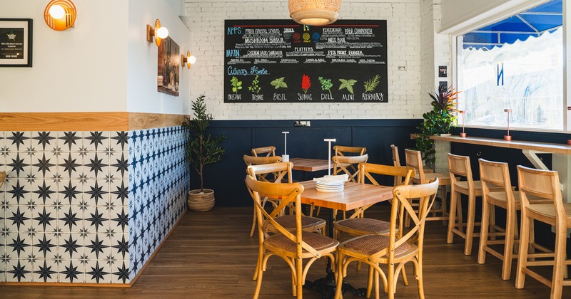 Cozy interior dining area, tables ready for guests
