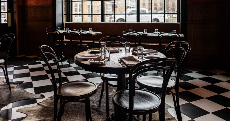 Interior, tables prepared for guests in dining area