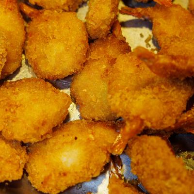 Close-up of fried breaded shrimp.
