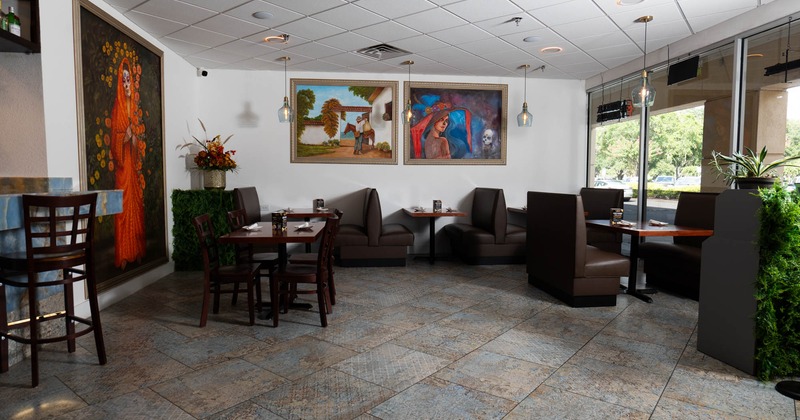 Interior, dining area, seating booths with tables, Mexico inspired paintings