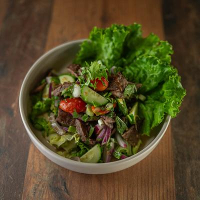 Sliced grilled beef salad.