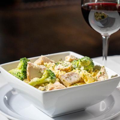 Chicken Alfredo pasta with broccoli.