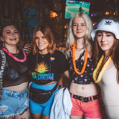 Interior, four guests posing for the photo