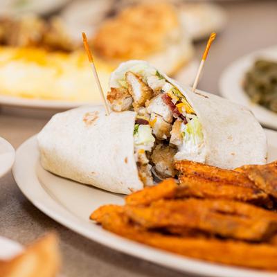 Fried chicken wrap and sweet potato fries.