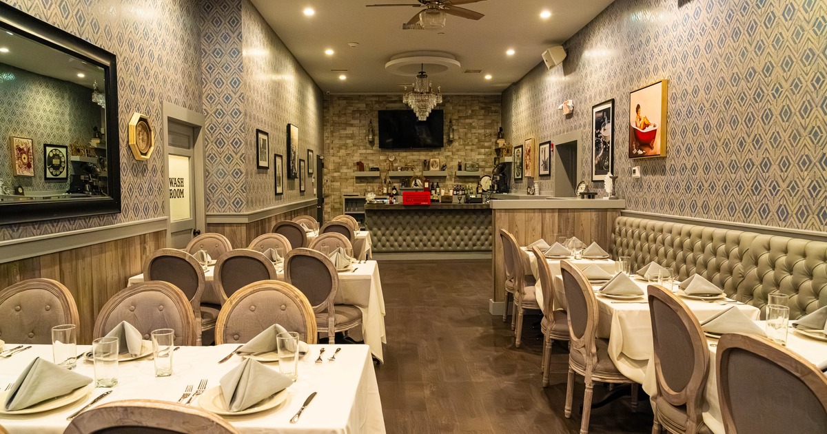 A vintage style restaurant interior with elegant seating, and a cozy ambiance