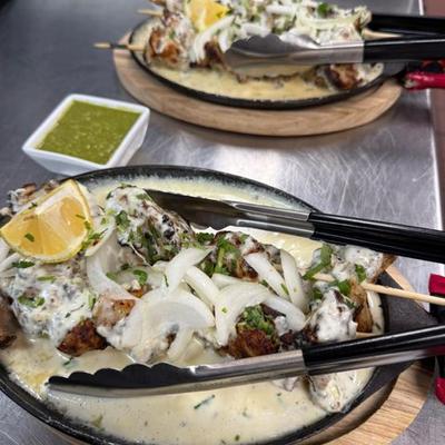 Chicken skewers, marinated in spiced yogurt.