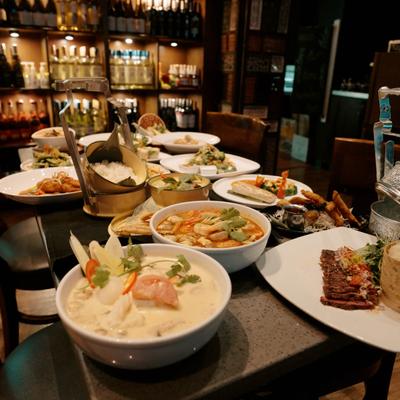 Table filled with assortment of dishes and sides.