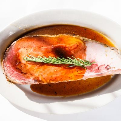 Prime Rib garnished with a spring of rosemary.
