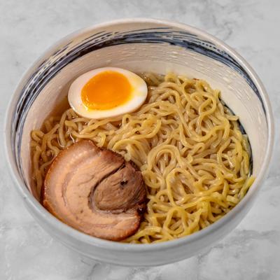 Pork belly with noodles and boiled egg.